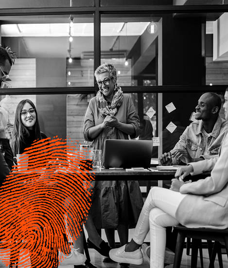 B&W image of people discussing with an orange stamp to the left of the image