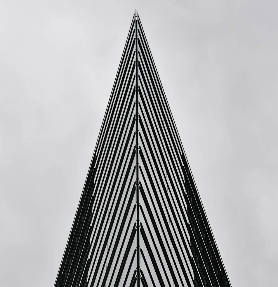 upwards view of a skyscraper in B&W